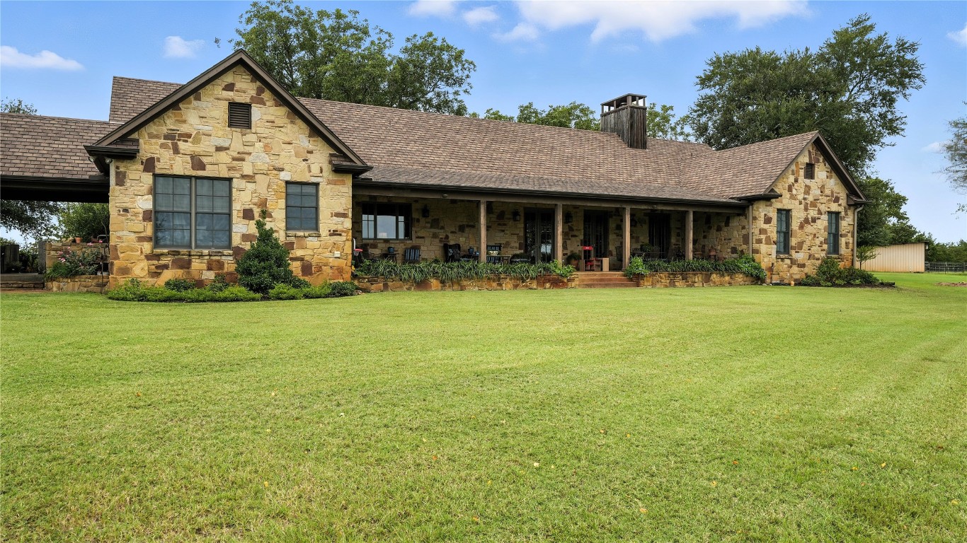 705 Antioch Road Paige, TX 78659 - Photo 13 of 40 a front view of house with yard and green space