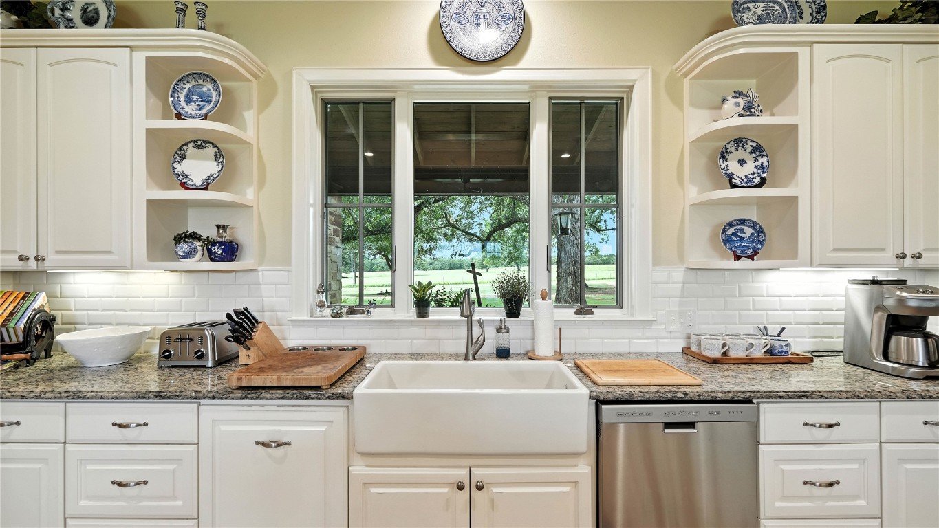 705 Antioch Road Paige, TX 78659 - Photo 18 of 40 a kitchen with a sink and a window