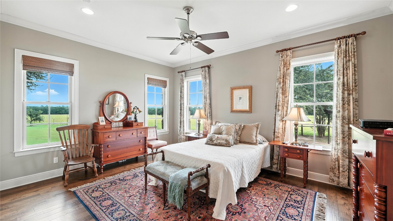 705 Antioch Road Paige, TX 78659 - Photo 23 of 40 a living room with a bed furniture and a large window