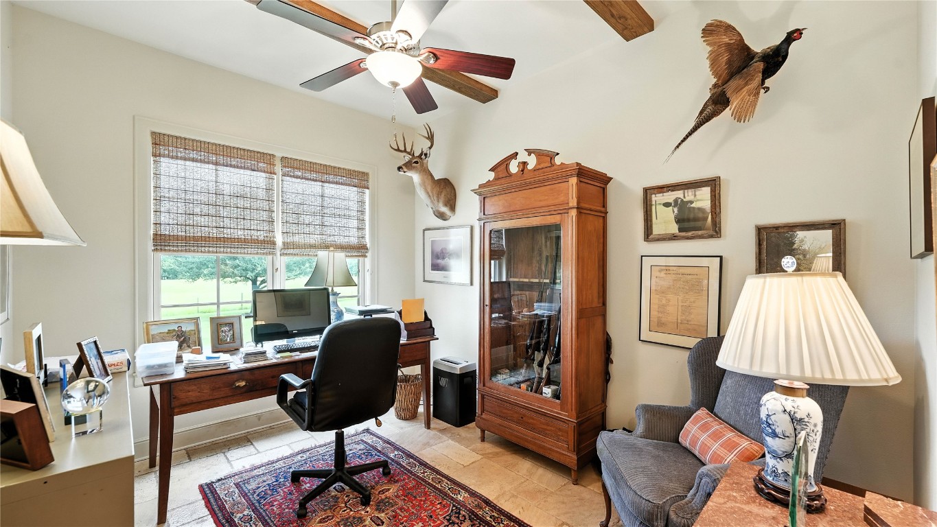 705 Antioch Road Paige, TX 78659 - Photo 24 of 40 a living room with furniture fireplace and a large window