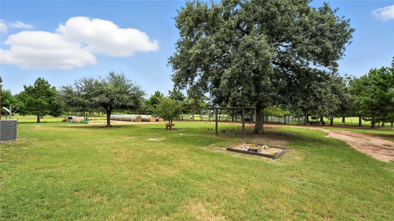 705 Antioch Road Paige, TX 78659 - Photo 33 of 40 a view of a playground with basketball court