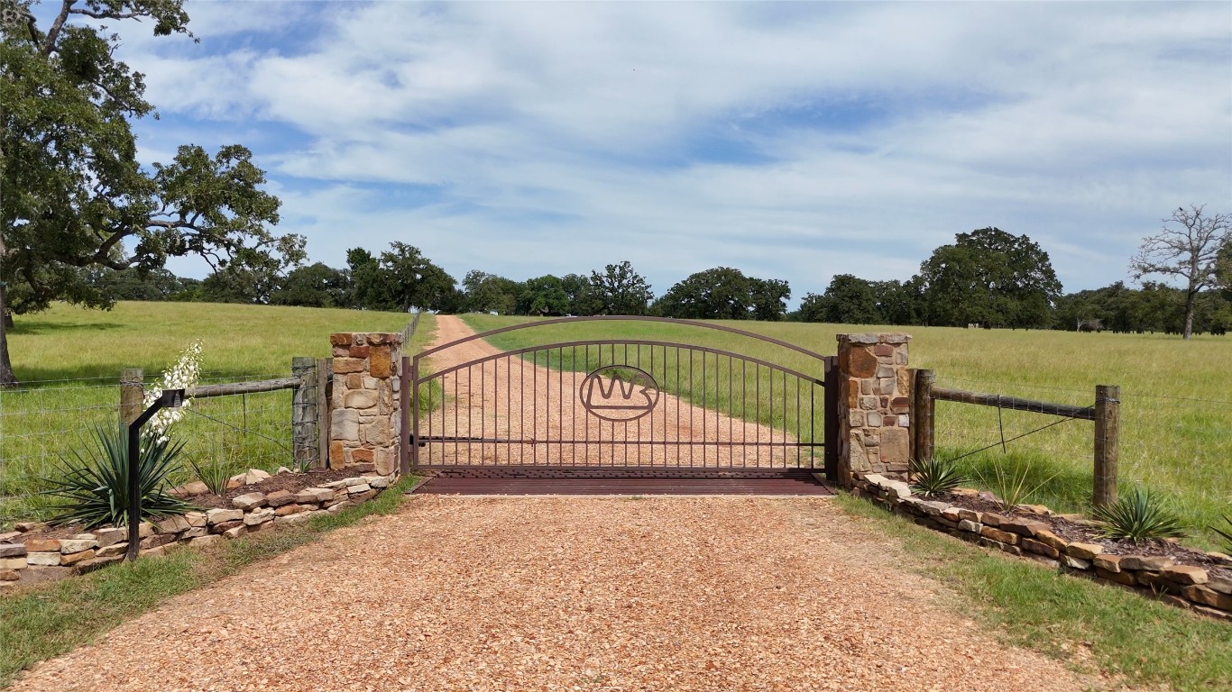 705 Antioch Road Paige, TX 78659 - Photo 4 of 40 a view of a lake with a garden