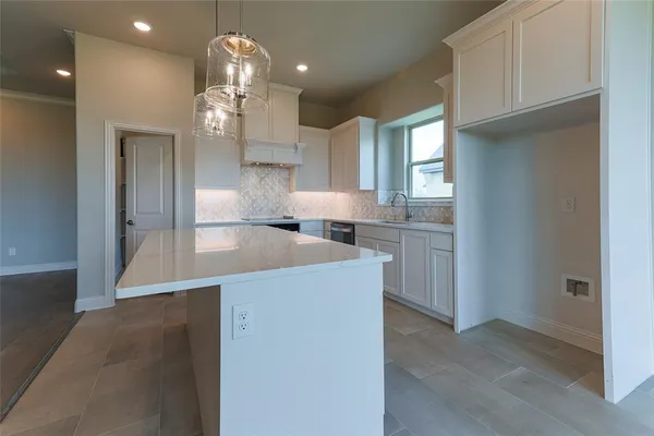 a view of a kitchen cabinets and wooden floor