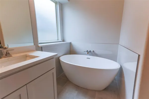 a white bath tub sitting in a bathroom