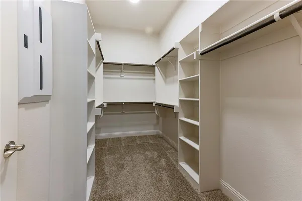 a view of an empty walk in closet