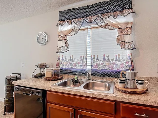 a kitchen with a sink and a stove