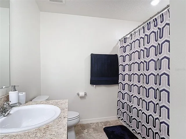 a bathroom with a toilet and a sink