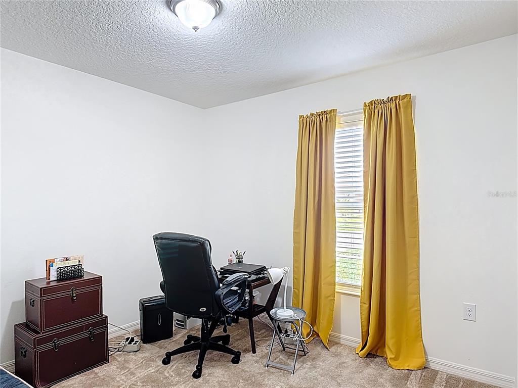 3216 Casa Del Rey Avenue Kissimmee, FL 34746 - Photo 25 of 32 a view of a workspace with furniture and a window