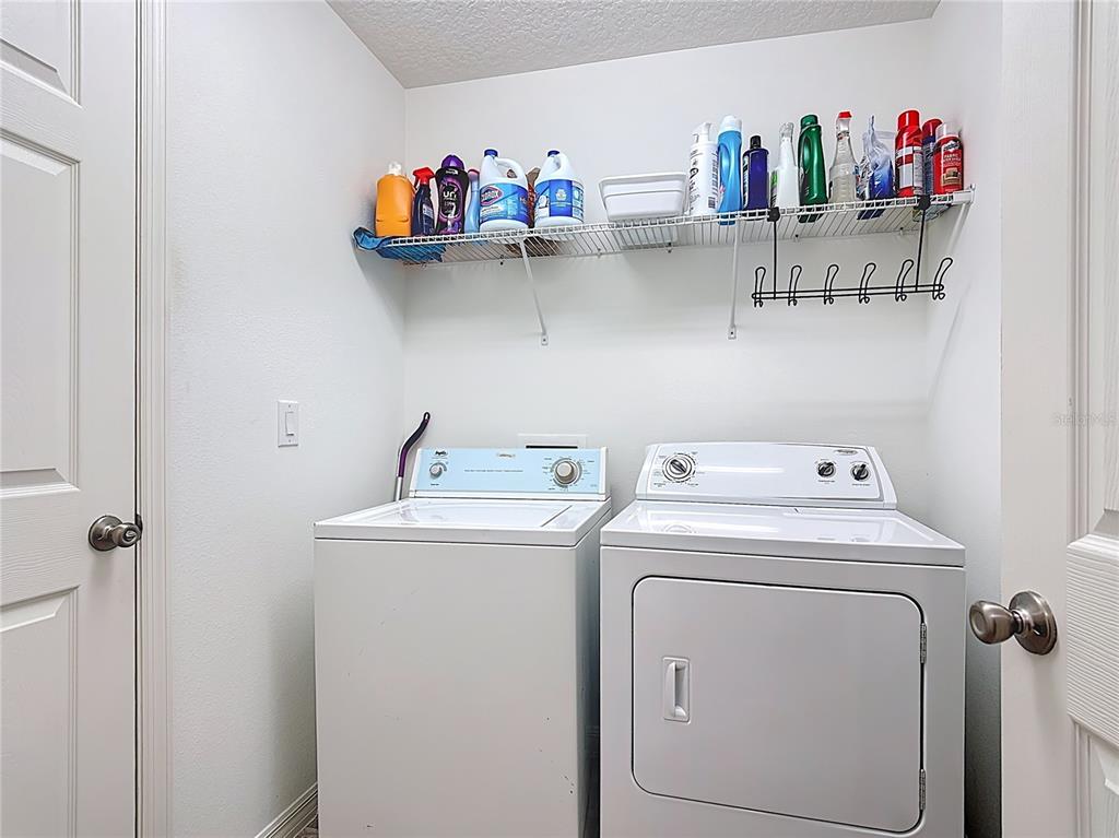 3216 Casa Del Rey Avenue Kissimmee, FL 34746 - Photo 27 of 32 a utility room with dryer and washer
