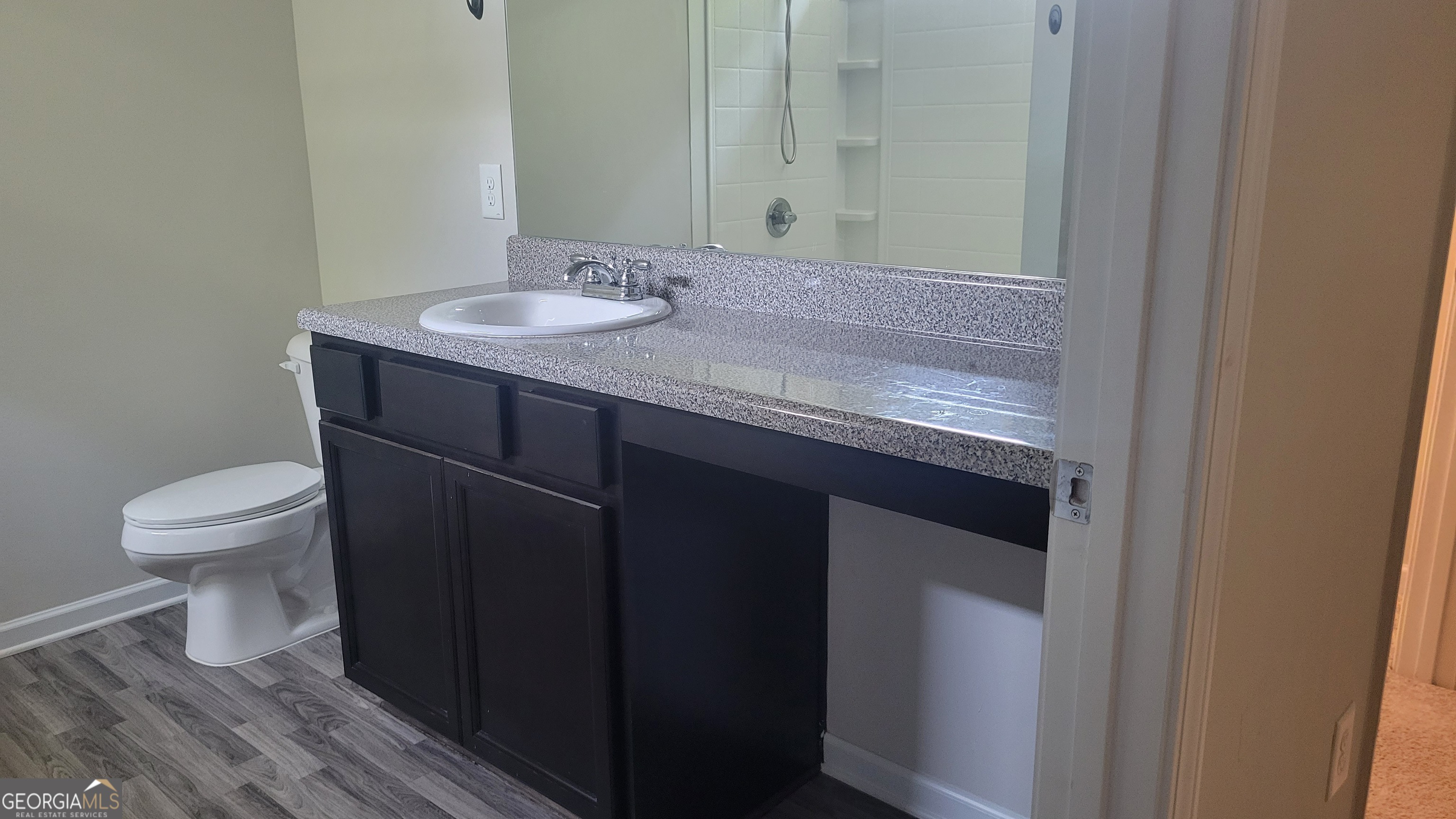 10 Bayberry Circle Southwest Rome, GA 30165 - Photo 26 of 38 a bathroom with a granite countertop sink a toilet and a mirror