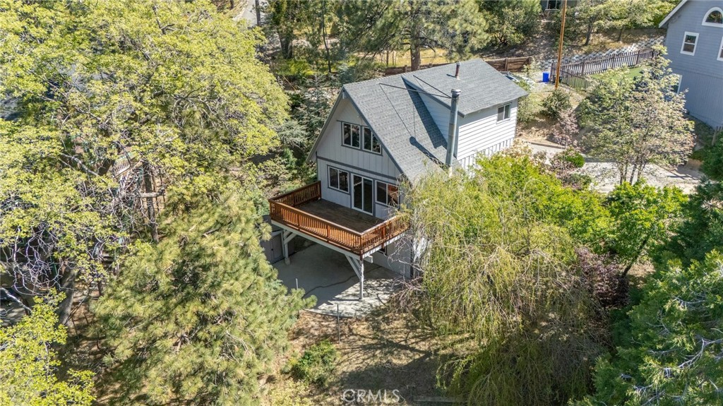1106 Grass Valley Road Lake Arrowhead, CA 92352 - Photo 14 of 57 an aerial view of a house with a yard and trees