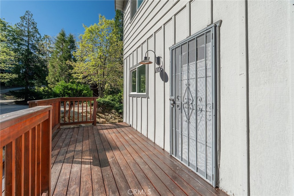 1106 Grass Valley Road Lake Arrowhead, CA 92352 - Photo 16 of 57 a view of balcony with wooden floor and fence
