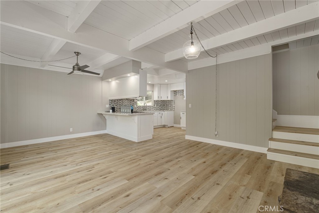 1106 Grass Valley Road Lake Arrowhead, CA 92352 - Photo 35 of 57 a view of a kitchen with a sink wooden floor and a ceiling fan