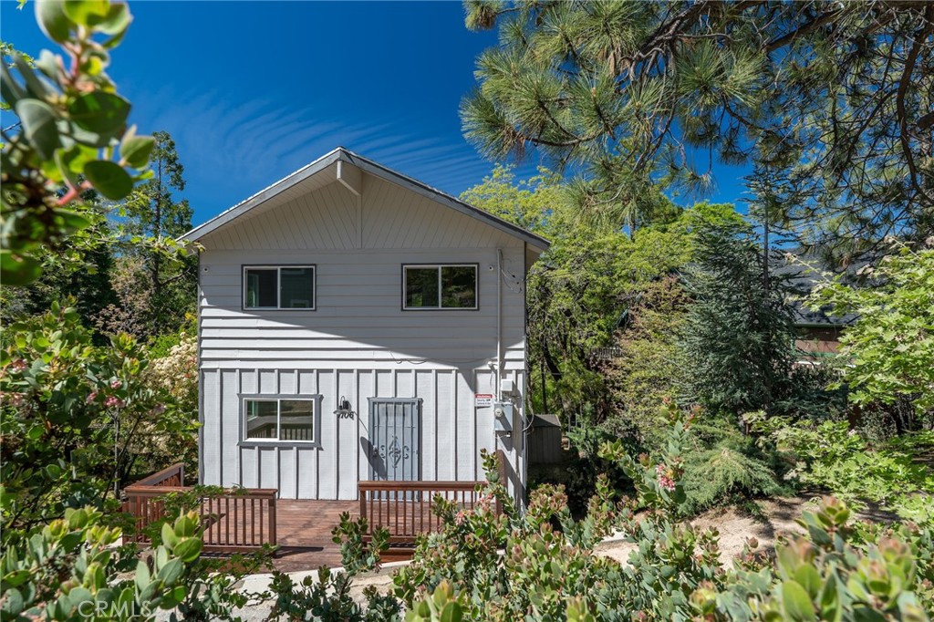1106 Grass Valley Road Lake Arrowhead, CA 92352 - Photo 43 of 57 a view of a house with a yard and plants