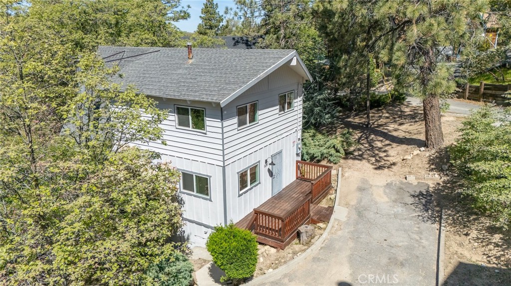 1106 Grass Valley Road Lake Arrowhead, CA 92352 - Photo 44 of 57 an aerial view of house with yard and trees in the background