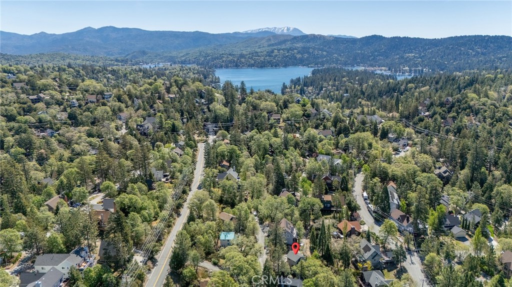 1106 Grass Valley Road Lake Arrowhead, CA 92352 - Photo 47 of 57 a view of a lush green hillside and a houses