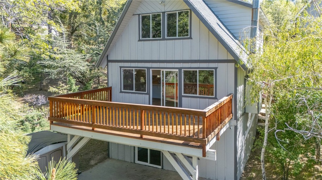 1106 Grass Valley Road Lake Arrowhead, CA 92352 - Photo 7 of 57 a view of a wooden deck with a bench