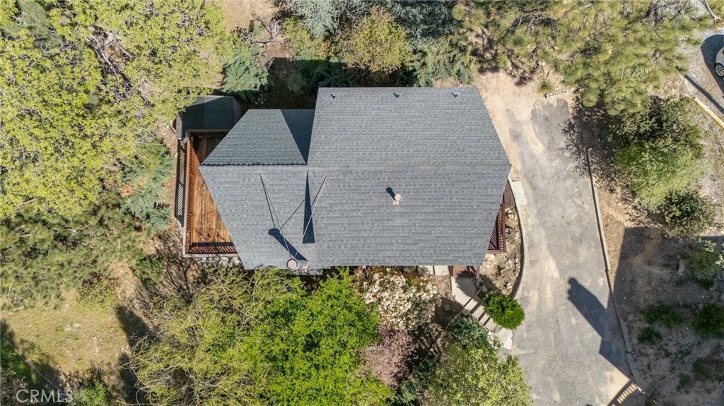 1106 Grass Valley Road Lake Arrowhead, CA 92352 - Photo 9 of 57 an aerial view of a house with yard and trees all around
