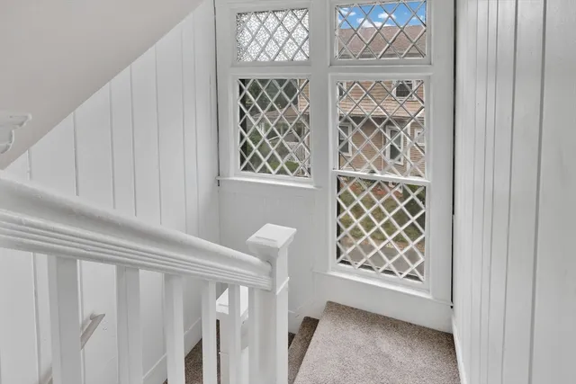 a bathroom with a granite countertop sink toilet and a mirror