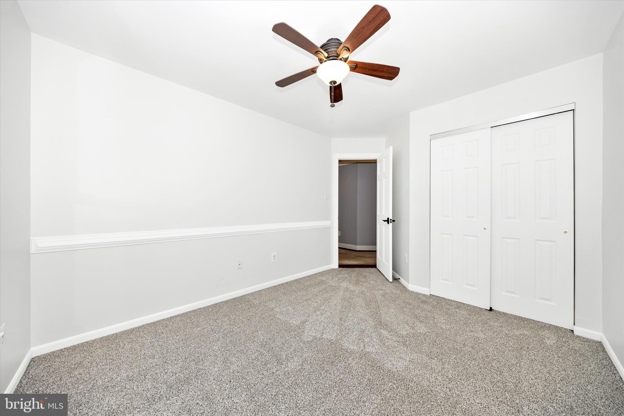803 Apache Court Frederick, MD 21701 - Photo 25 of 46 an empty room with ceiling fan and window
