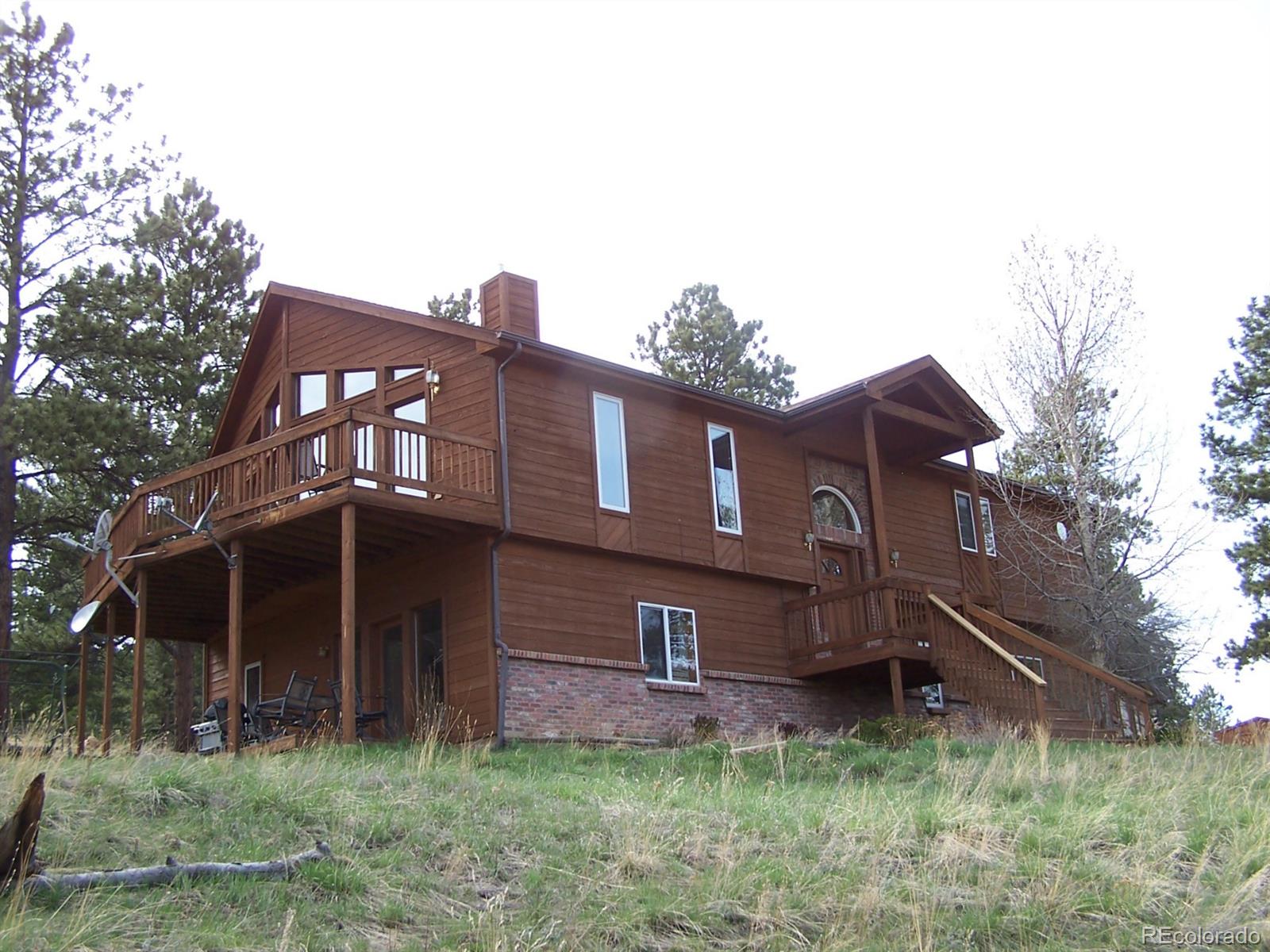 1200 Conestoga Road Bailey, CO 80421 - Photo 1 of 1 a house view with a outdoor space