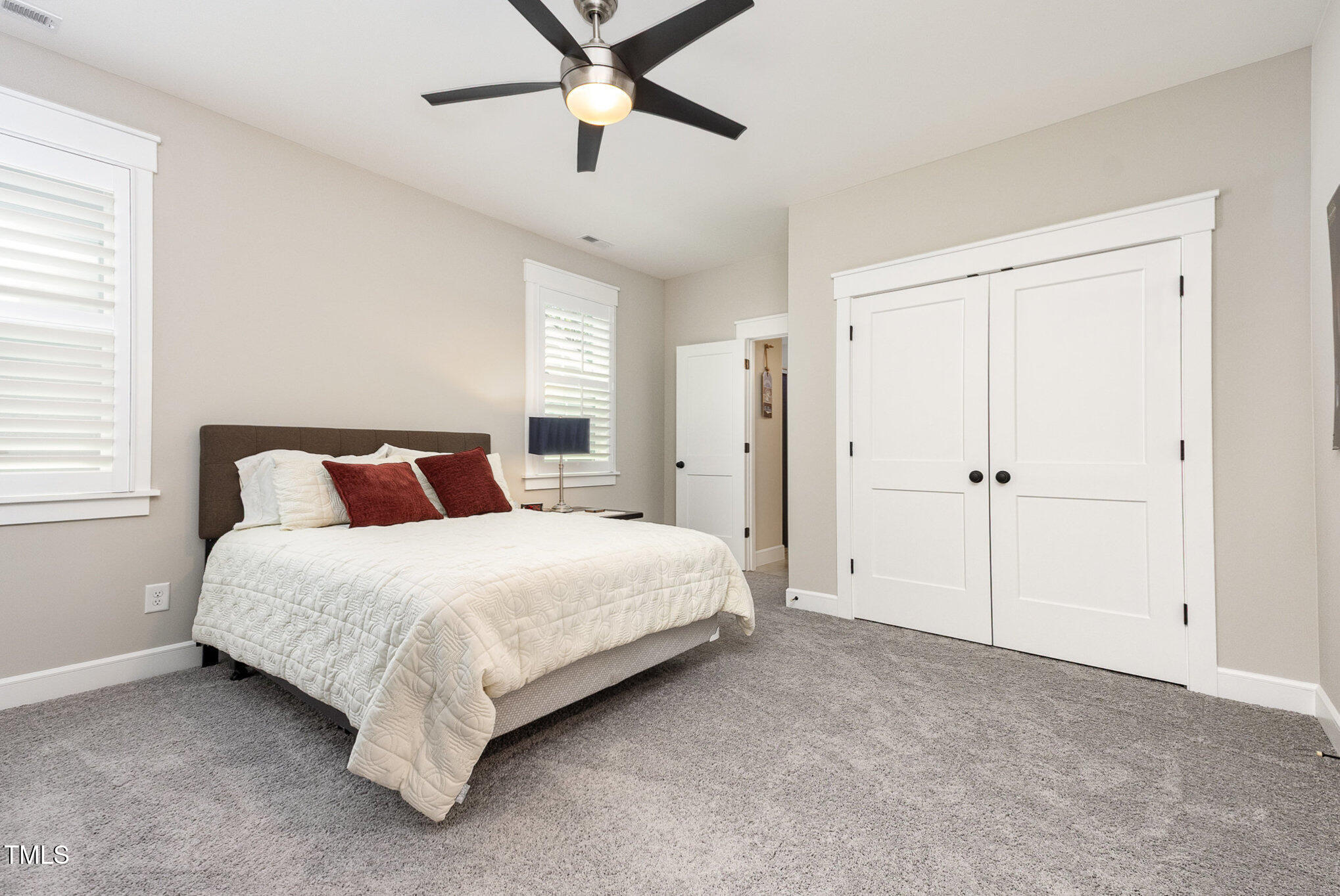 3608 Dixon Road Durham, NC 27707 - Photo 17 of 32 a spacious bedroom with a bed and window