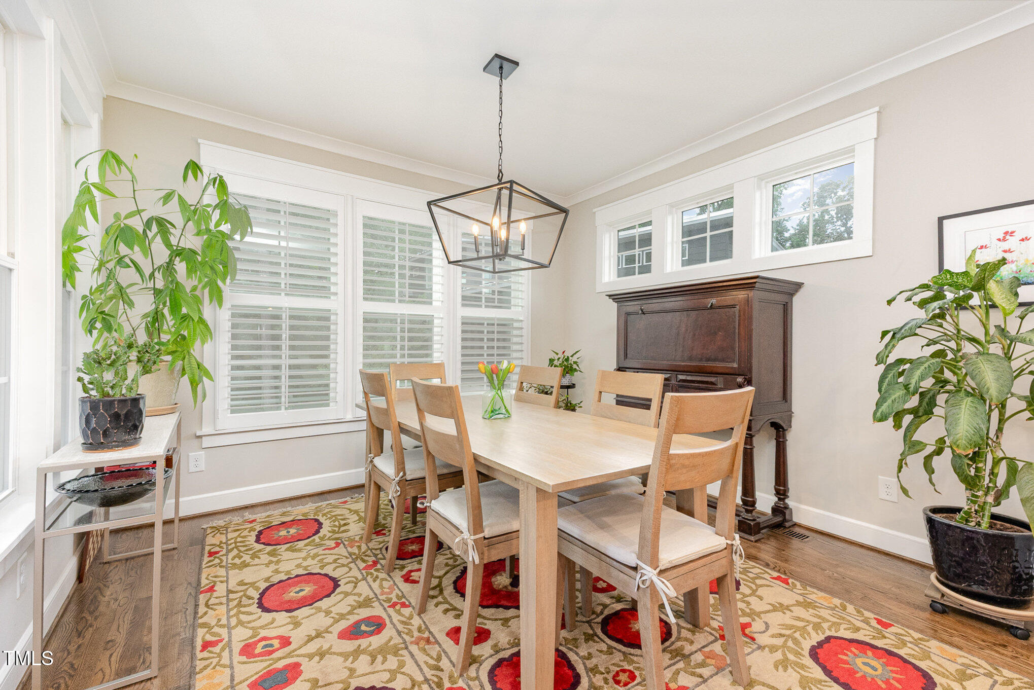 3608 Dixon Road Durham, NC 27707 - Photo 8 of 32 a view of a dining room with furniture window and wooden floor