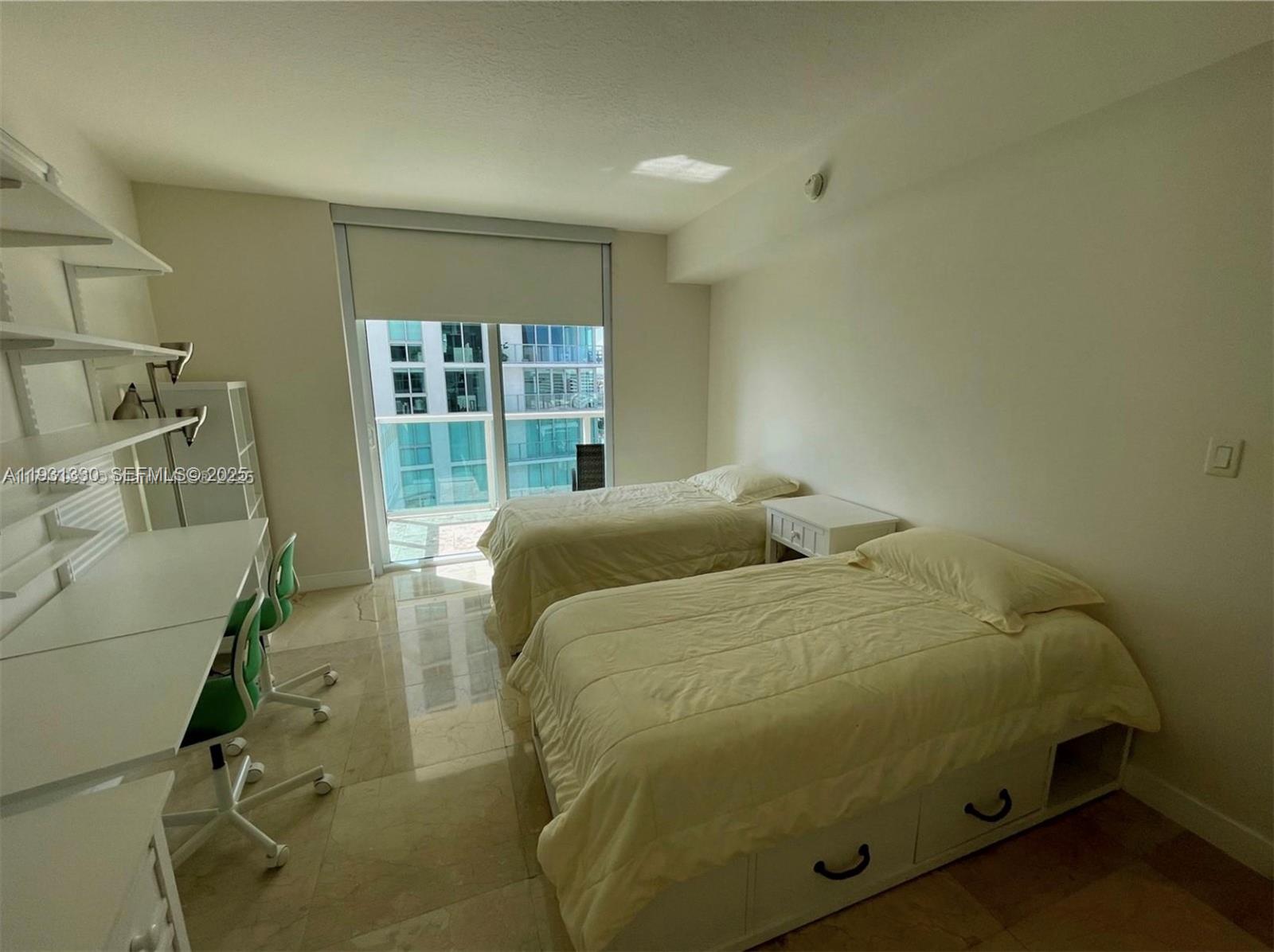 250 Sunny Isles Boulevard, Unit 31003 Sunny Isles Beach, FL 33160 - Photo 23 of 25 a bedroom with a bed and a window