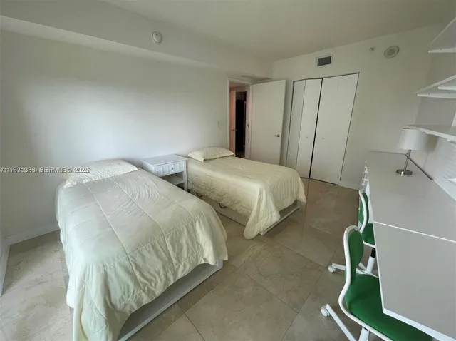 a view of house with a large window and wooden fence