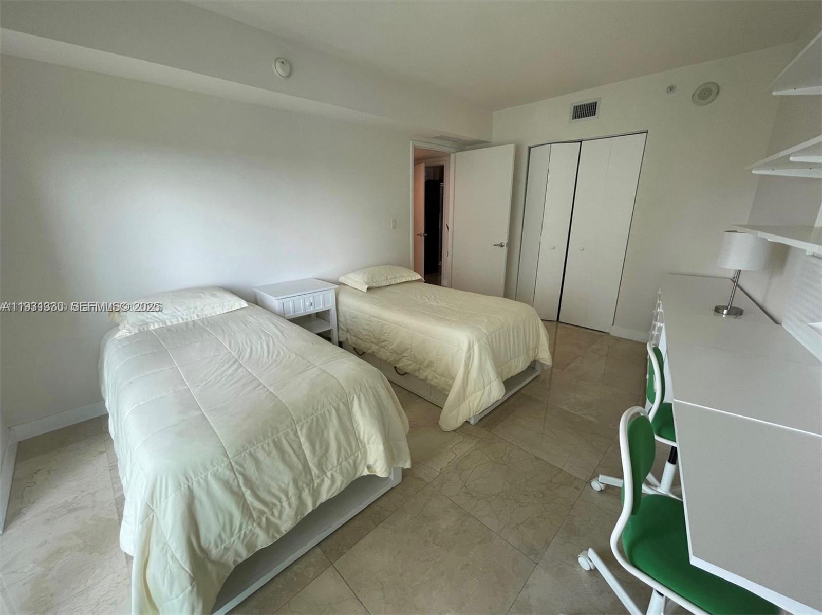 250 Sunny Isles Boulevard, Unit 31003 Sunny Isles Beach, FL 33160 - Photo 24 of 25 a bedroom with two beds and a window