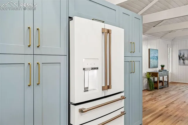 a view of kitchen with furniture and wooden floor