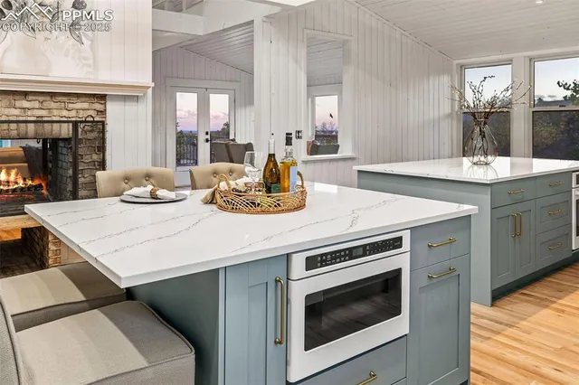 a kitchen with a sink stove and cabinets