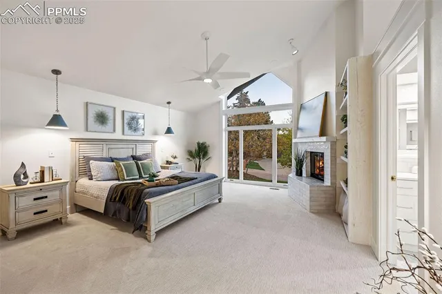 a spacious bedroom with a bed couch and a window