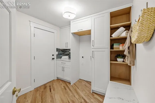 a bathroom with a sink mirror vanity and toilet