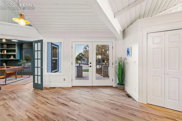 a reading room with furniture and a book shelf