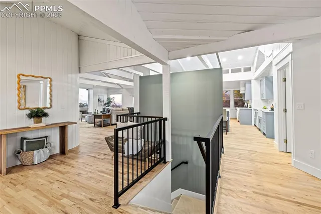 an empty room with windows and pillars in it