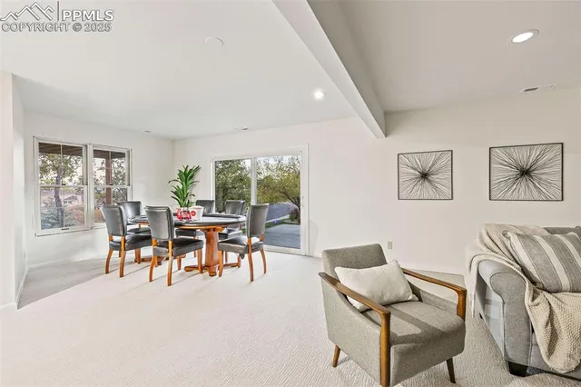 a view of a livingroom with furniture and a fireplace