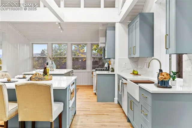 a kitchen with a sink stove and cabinets