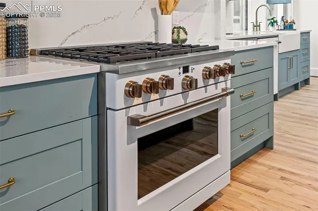 a close view of a stove top oven sitting inside of a kitchen