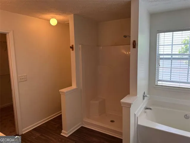 a bath tub sitting next to a window