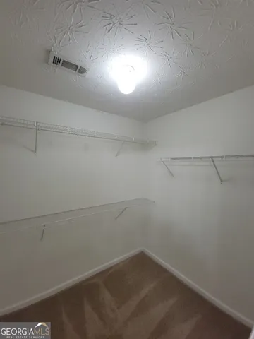 a view of a room with racks on the wall