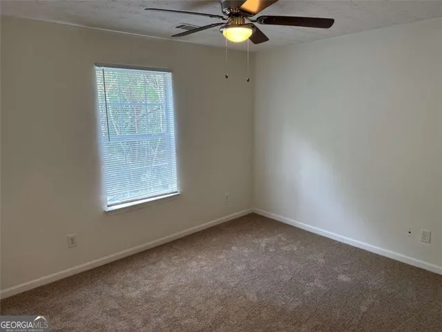 a view of a back yard of the house