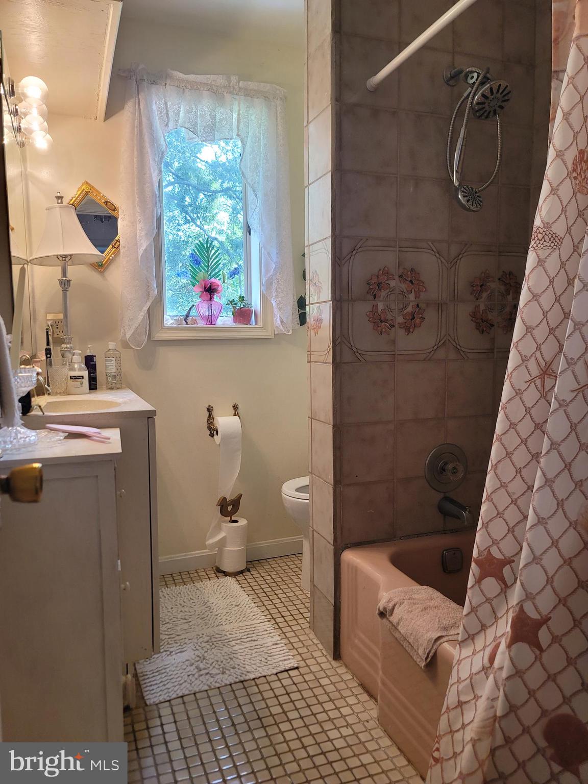 6910 Gilbert Street Springfield, VA 22150 - Photo 14 of 29 a bathroom with a sink toilet and shower