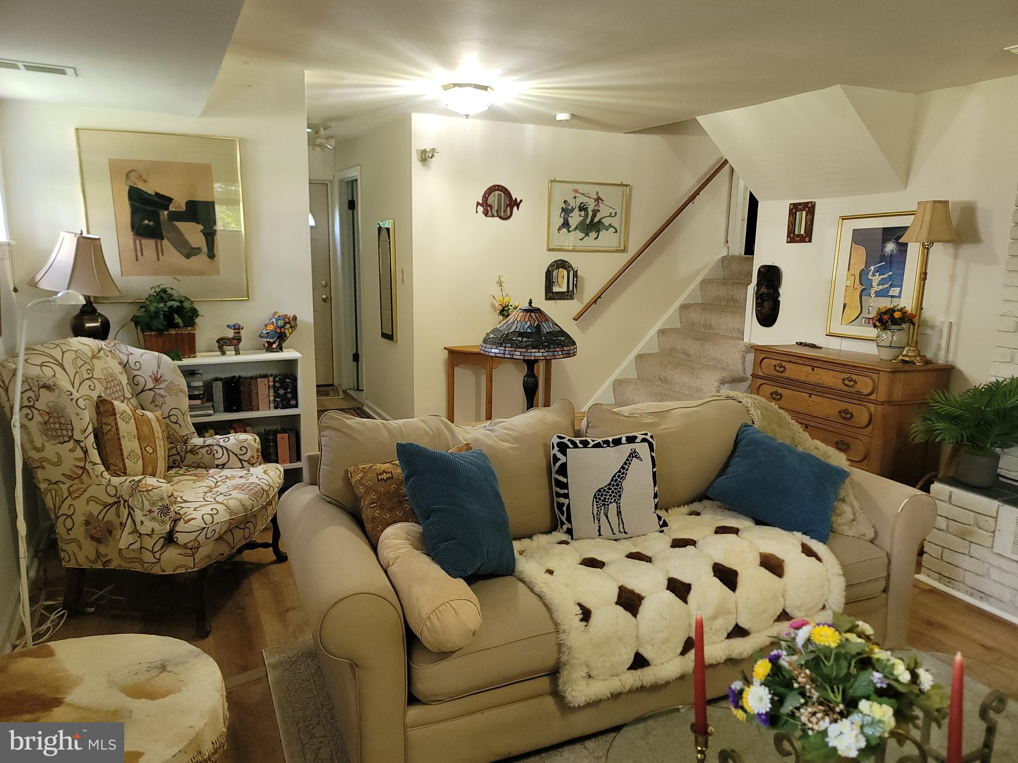 6910 Gilbert Street Springfield, VA 22150 - Photo 16 of 29 a living room with furniture and flowers