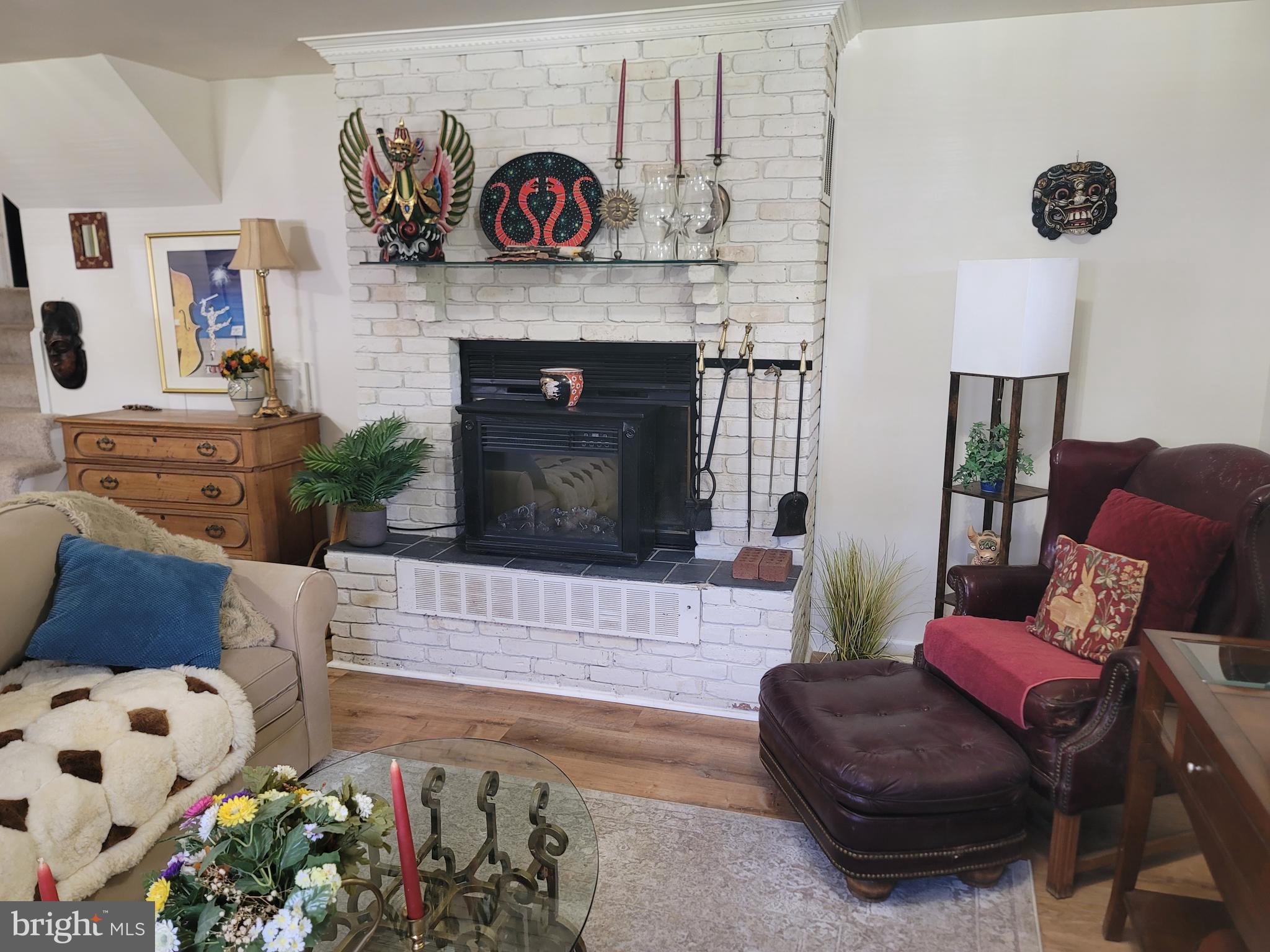 6910 Gilbert Street Springfield, VA 22150 - Photo 17 of 29 a living room with furniture and a fireplace