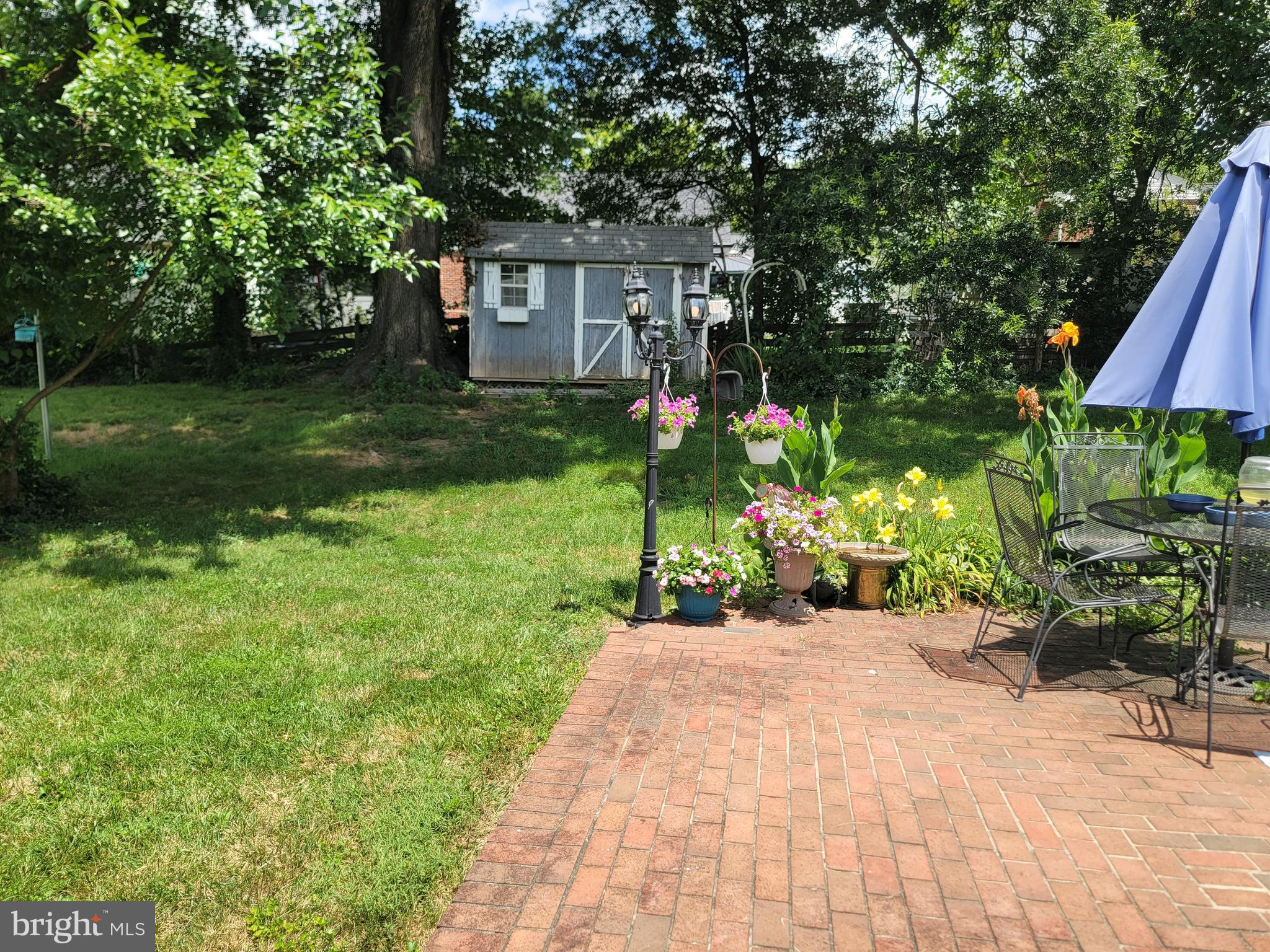6910 Gilbert Street Springfield, VA 22150 - Photo 24 of 29 a front view of a house with garden