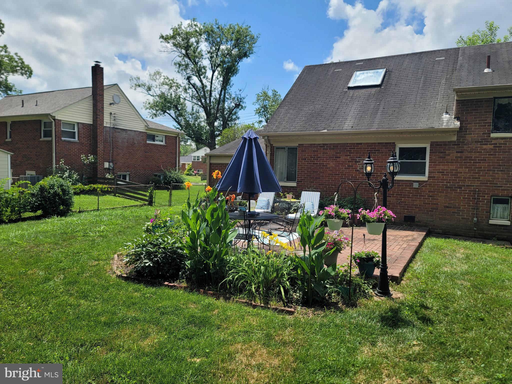 6910 Gilbert Street Springfield, VA 22150 - Photo 29 of 29 a view of house with a yard and sitting area