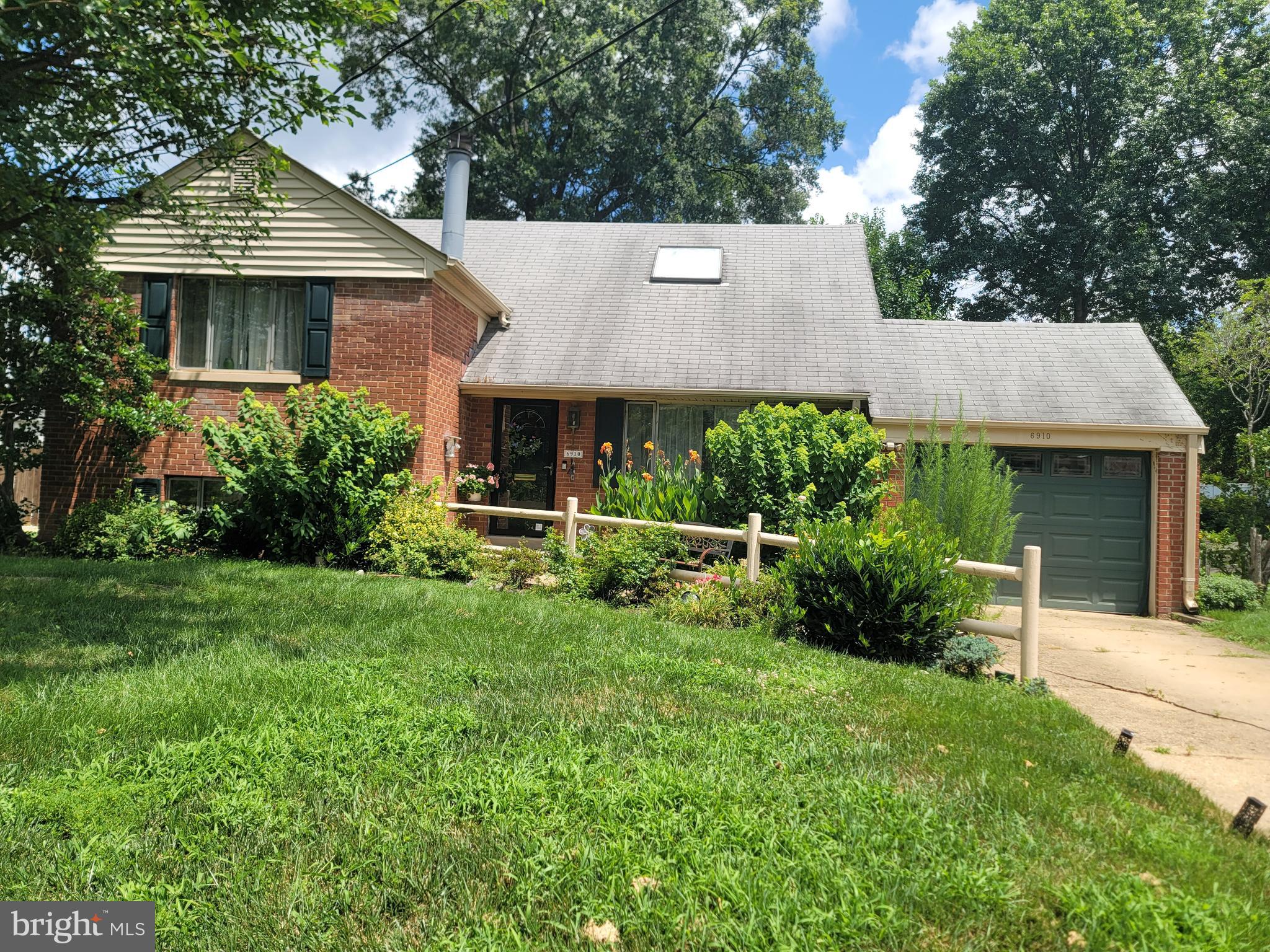 6910 Gilbert Street Springfield, VA 22150 - Photo 3 of 29 a aerial view of a house with table and chairs under an umbrella