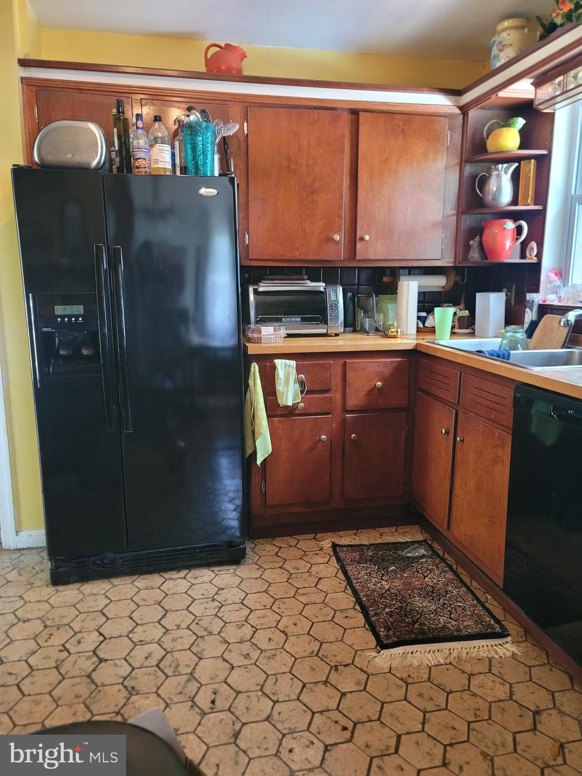 6910 Gilbert Street Springfield, VA 22150 - Photo 8 of 29 a refrigerator freezer sitting inside of a kitchen