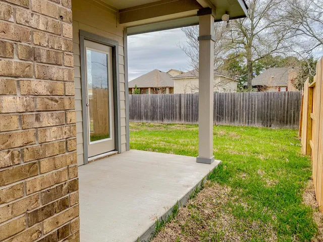 a view of backyard with green space